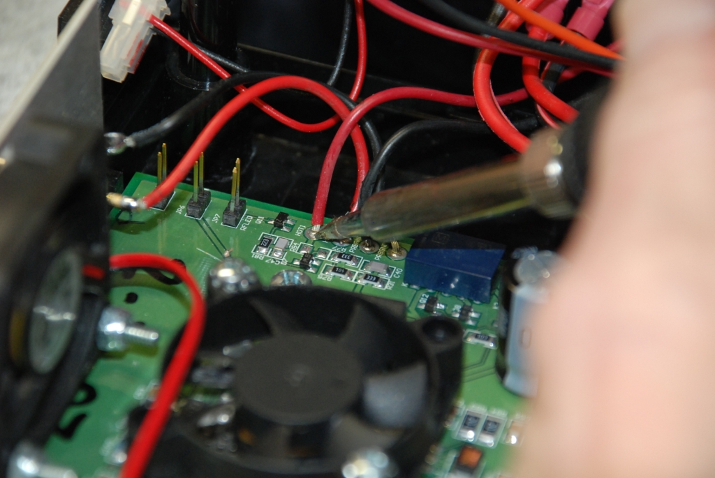Unsoldering the wires from the top of the board.