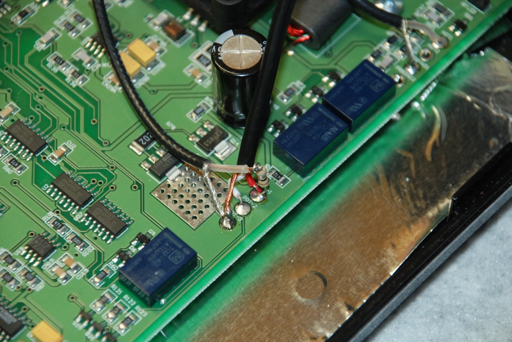 Passing the BNC cable center conductor through the resistor loop.